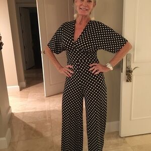 One piece, back tie, black with white polka dots, size M.